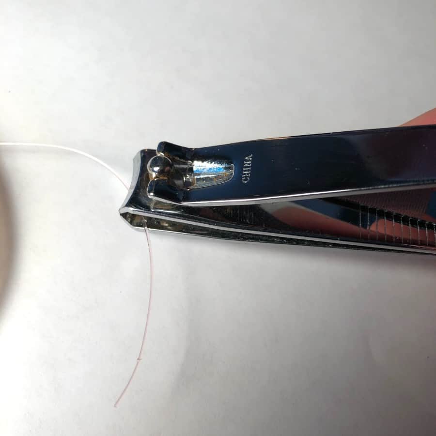 fingernail clippers clipping fishing line