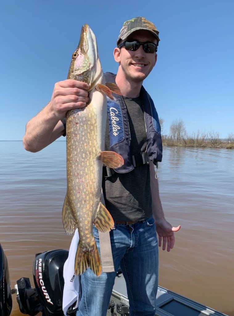 andrew juran-holding-northern-pike-on-boat