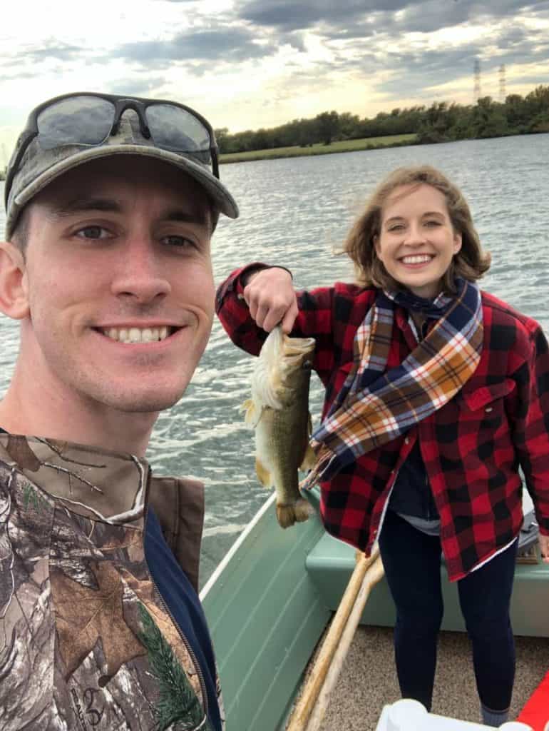 andrew juran and ornella juran-holding-largemouth-bass-on-boat