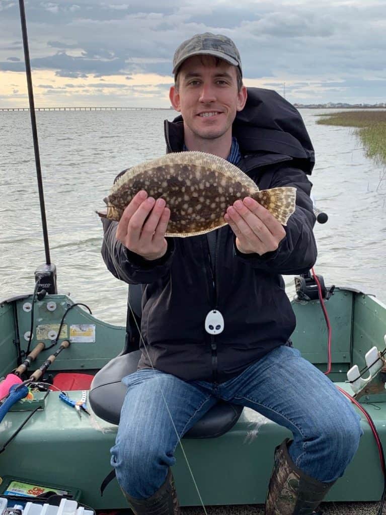 Power Pole Micro engaged in heavy current allows man to catch and pose with flounder