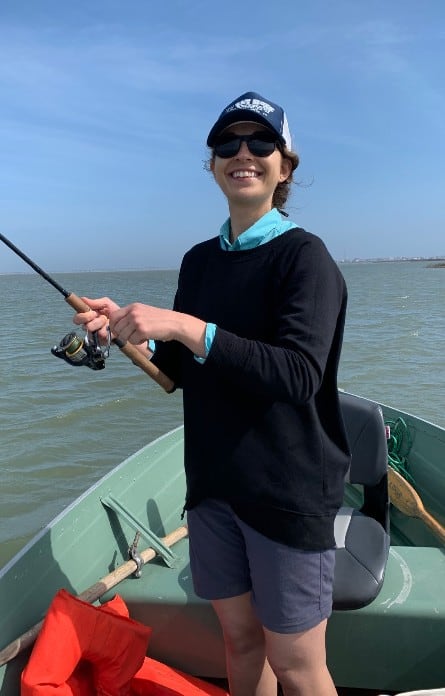ornella juran smiling while fishing in boat