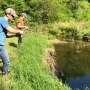 andrew juran and ornella juran using ultralight fishing rods trout fishing in creek