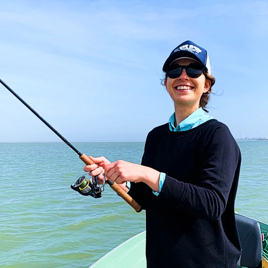 ornella juran holding spinning rod and reel combo saltwater fishing