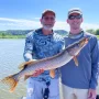 andrew juran and papa juran holding Northern pike caught on the mississippi river