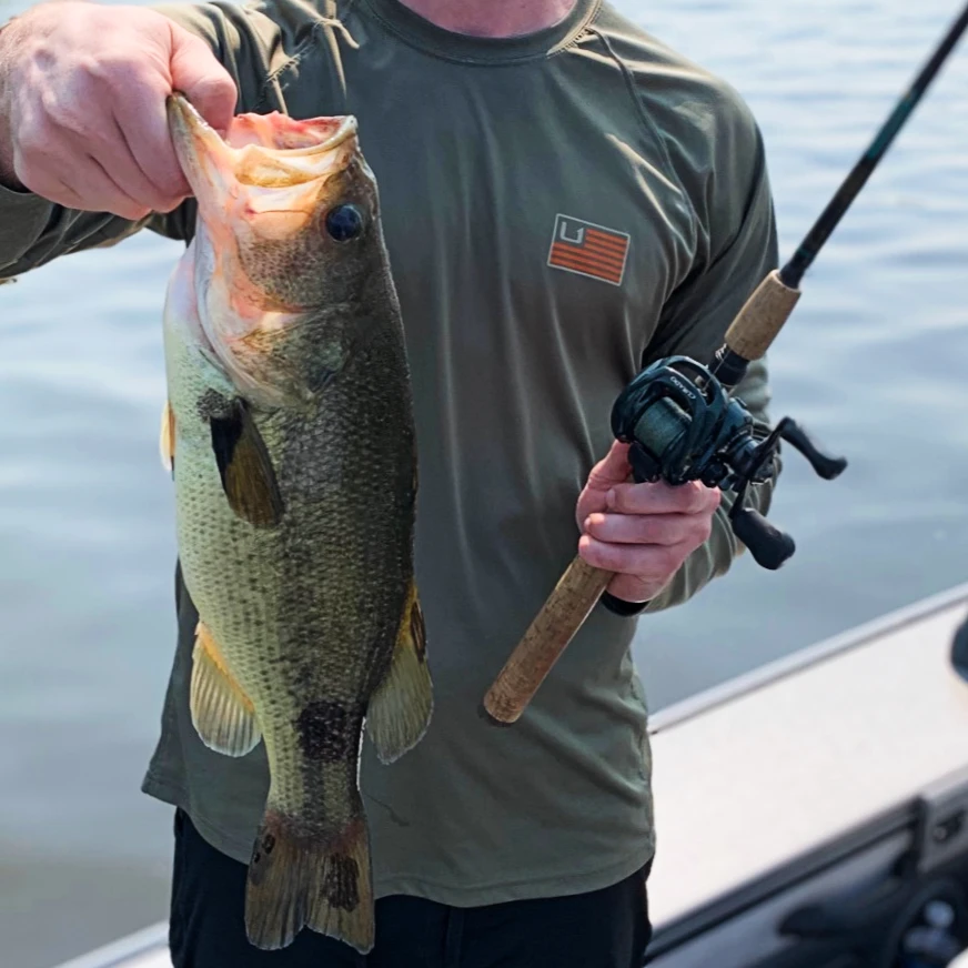 andrew juran holding Shimano Curado Baitcasting Reel with Largemouth Bass