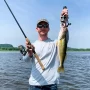 andrew juran holding st croix premier spinning rod with walleye