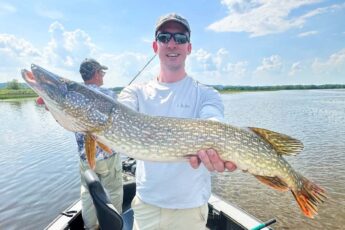 andrew juran holding Huge Northern Pike Caught with Shimano Curado K baitcasting reel