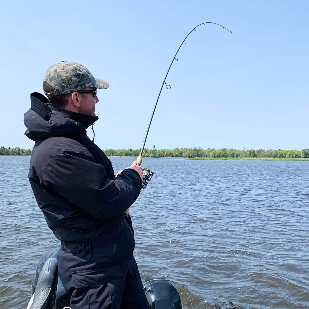 andrew juran holding Medium power st croix fishing rod with fast action bent over under stress while reeling in a fish